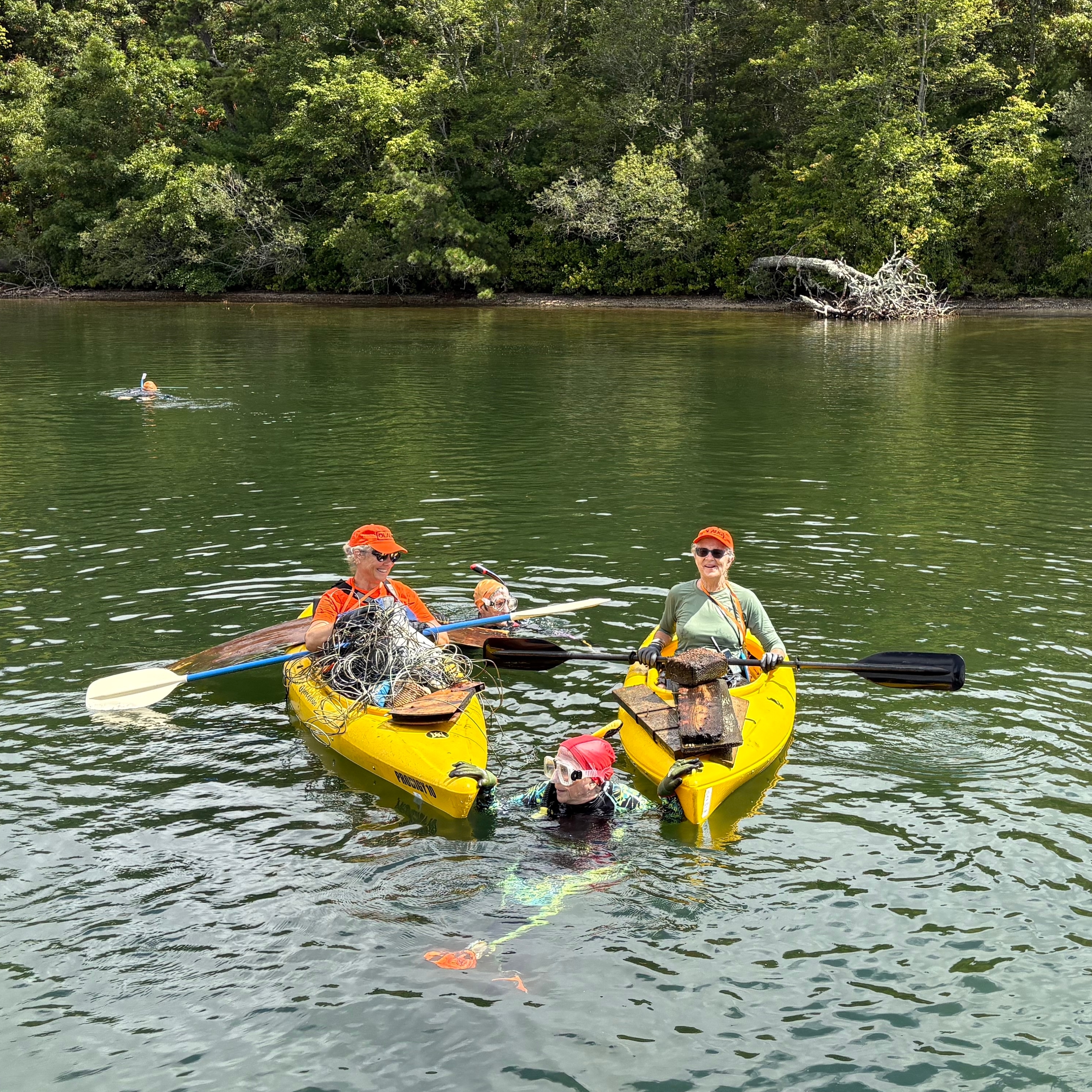 The group diving for beer cans and baby doll heads